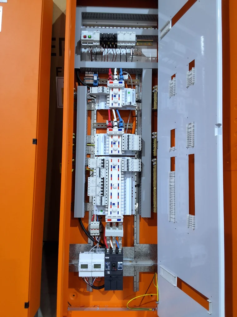Distribution board with chassis and breakers fitted